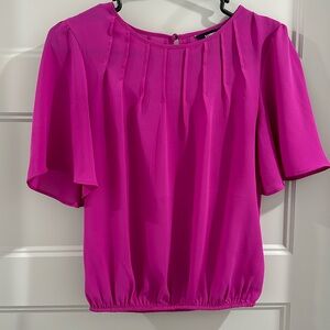 Beautiful Magenta blouse. In great shape and very lightweight and comfortable.